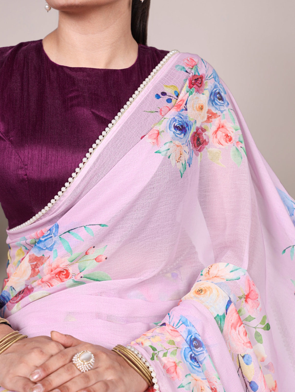 Soft, flowy marble sarees with graceful floral motifs and a refined lace border for added charm