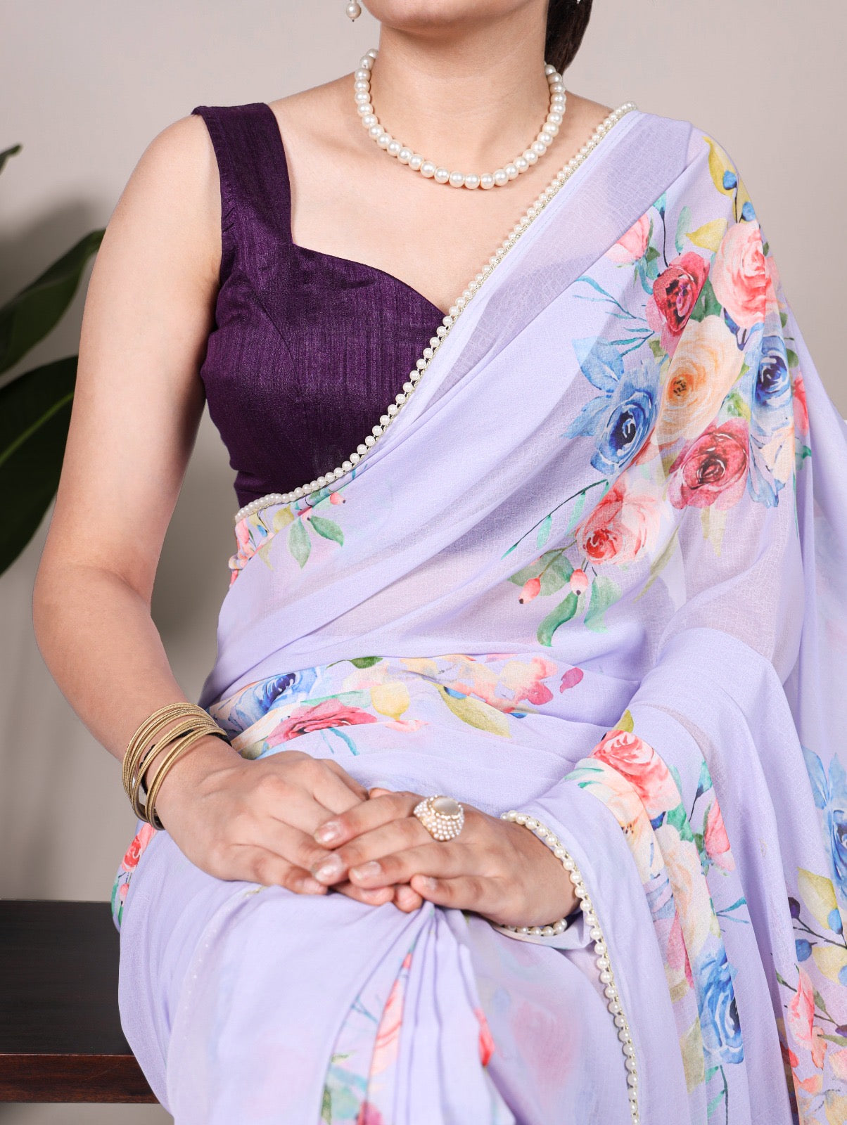 Premium weightless marble sarees crafted with gentle floral prints highlighted by an exquisite lace border.