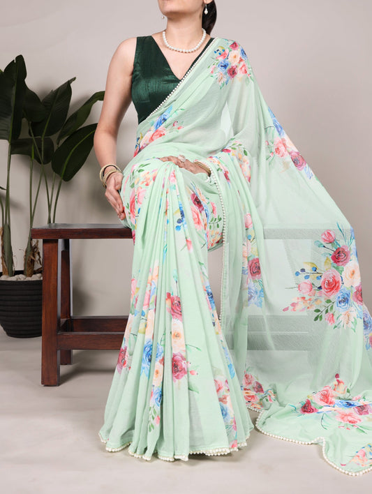 Premium weightless marble sarees crafted with soft, graceful floral prints, further enhanced by a delicate lace border