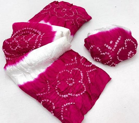 Luxurious Gajji silk saree adorned with vibrant contrast Bandhani patterns, ideal for festive and special occasions.