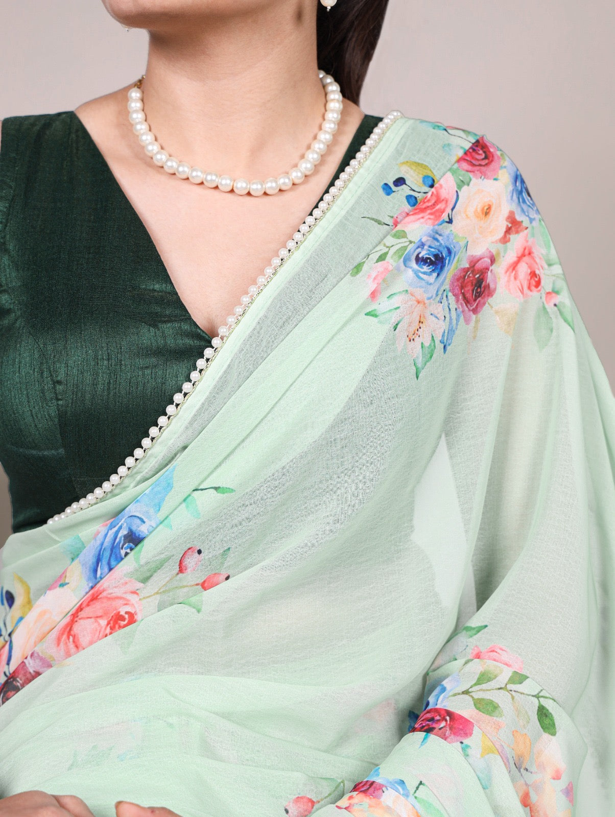 Premium weightless marble sarees crafted with soft, graceful floral prints, further enhanced by a delicate lace border