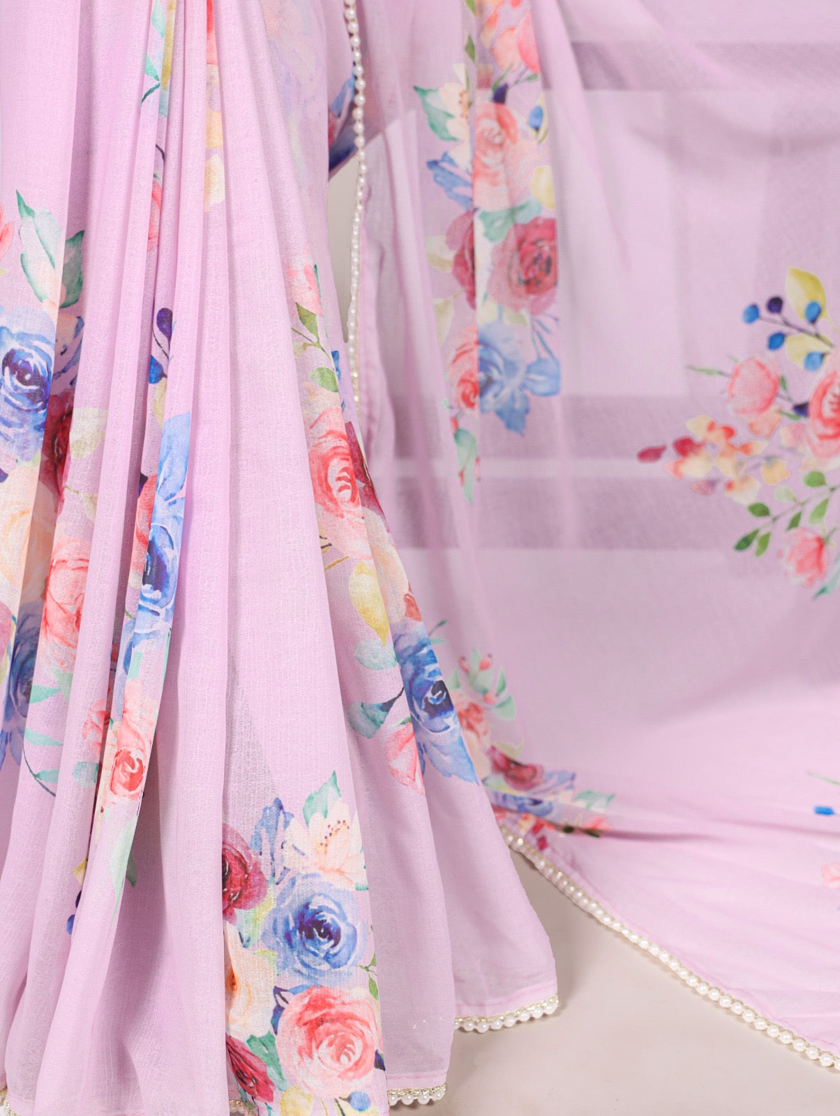 Soft, flowy marble sarees with graceful floral motifs and a refined lace border for added charm