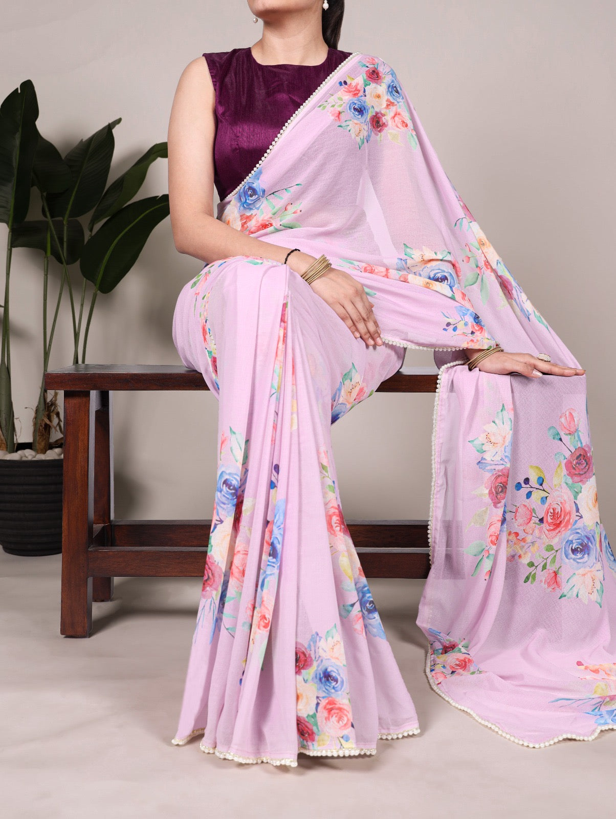 Soft, flowy marble sarees with graceful floral motifs and a refined lace border for added charm