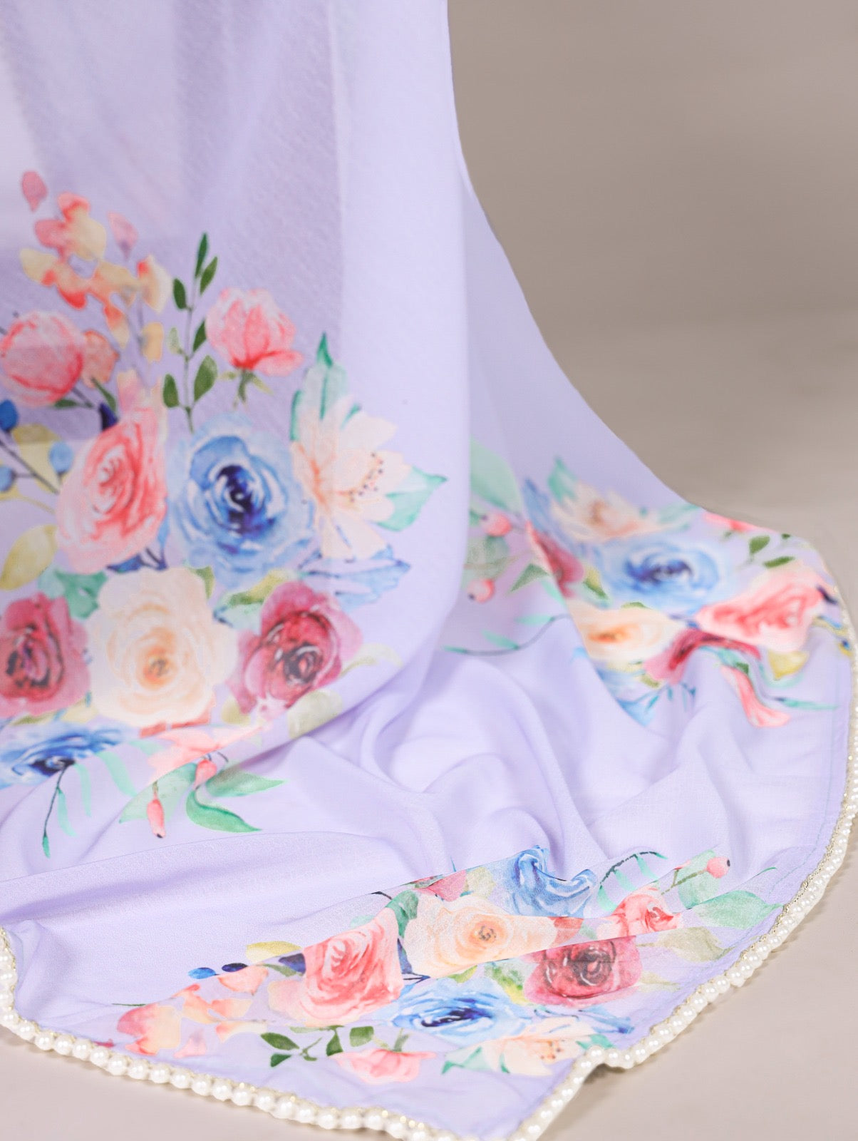 Premium weightless marble sarees crafted with gentle floral prints highlighted by an exquisite lace border.