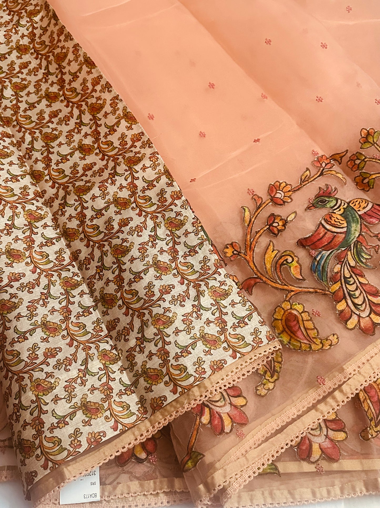 Beautiful Light Weight Baby Orange Organza saree, Adorned with Intricate Kalamkari Patchwork Along The Border.