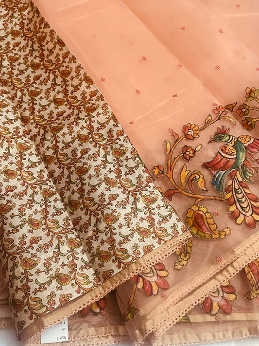 Beautiful Light Weight Baby Orange Organza saree, Adorned with Intricate Kalamkari Patchwork Along The Border.