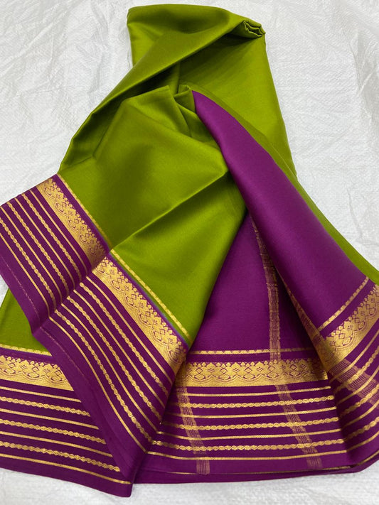 Embrace Heritage with a Modern Flair: The Green and purple saree with gold border Pure Mysore/Crepe Silk Saree