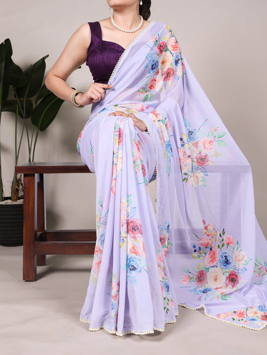 Premium weightless marble sarees crafted with gentle floral prints highlighted by an exquisite lace border.